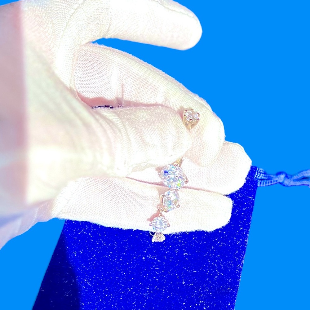 Belly Bling stainless steel with huge CZ’s in a graduated dangling form.
